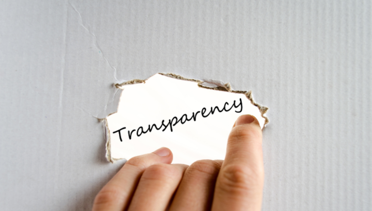 Torn cardboard displaying the word transparency