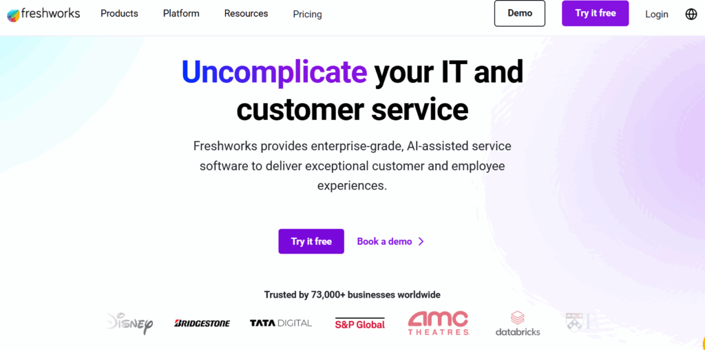 Freshworks homepage highlighting slogan 'Uncomplicate your IT and customer service' with options to try it free or book a demo, and logos of companies like Disney, Bridgestone, and AMC Theatres.