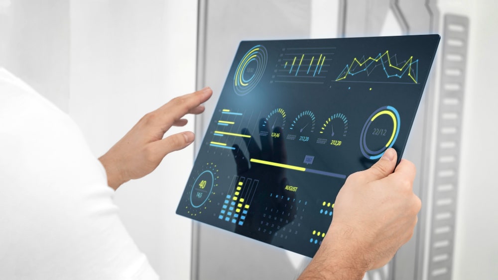 Person using a digital dashboard to view automated performance metrics.